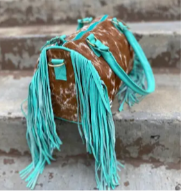 Turquoise, cowhide fringe mini duffel bag